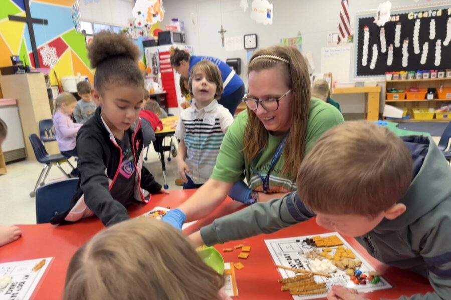 St. James Lutheran School staff member with student